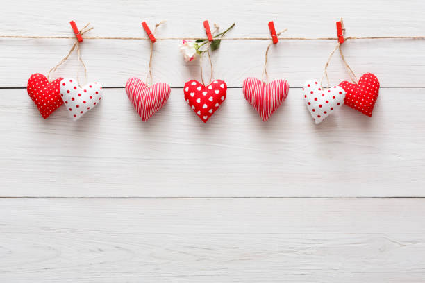 istock Valentine day background, pillow hearts border on wood, copy space 912065198