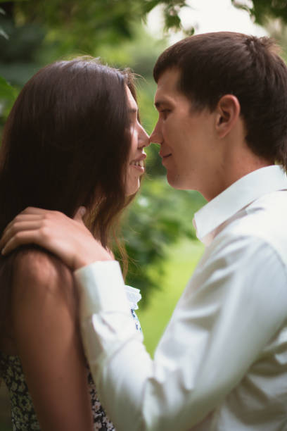 istock Beautiful young couple in the park 912065208