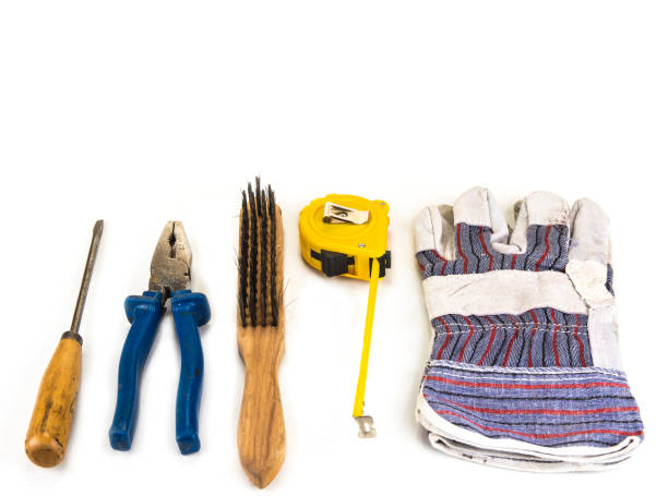 istock Old handyman tools with gloves on the white background 912065866
