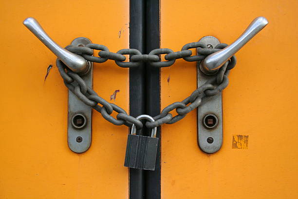 Closed plus locked with chain and padlock  door chain stock pictures, royalty-free photos & images