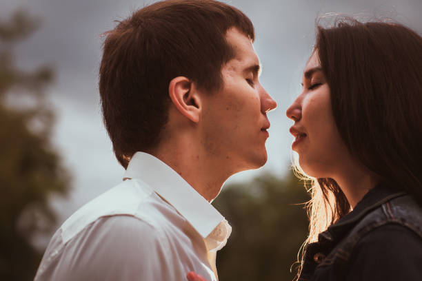 istock Beautiful young couple on the waterfront 912068348