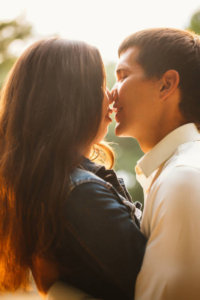 istock Beautiful young couple on the lake background 912068704