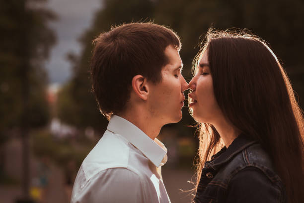 istock Beautiful young couple on the waterfront 912069336