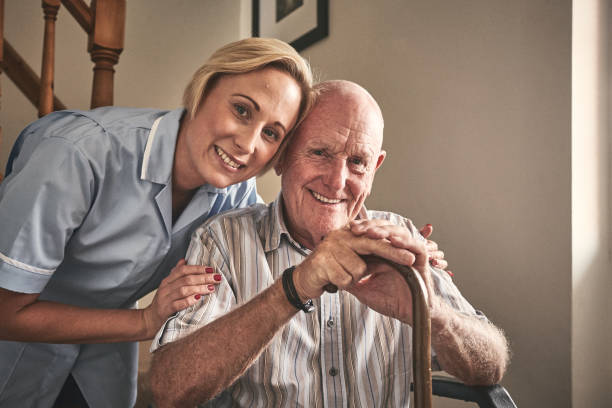 istock Smiling home carer with senior patient 912072088