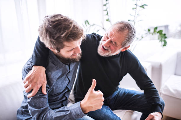 istock Hipster son with his senior father at home. 912073048