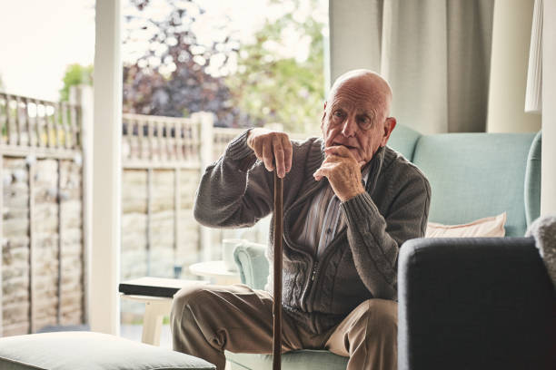 istock Senior man  sitting alone at home and thinking 912073254