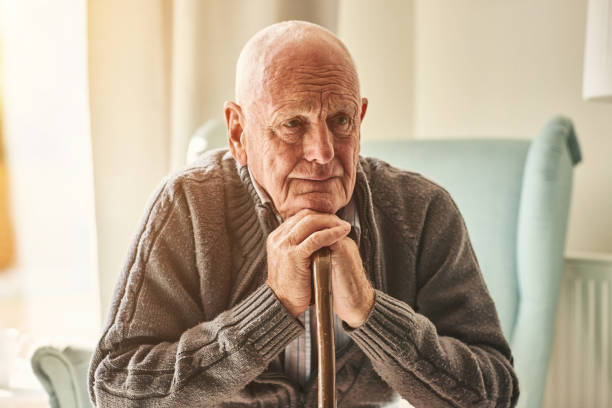 istock Lonely senior man sitting at home 912073304