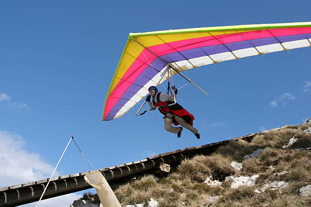 Hangglider in action Hangglider in action hang glider stock pictures, royalty-free photos & images