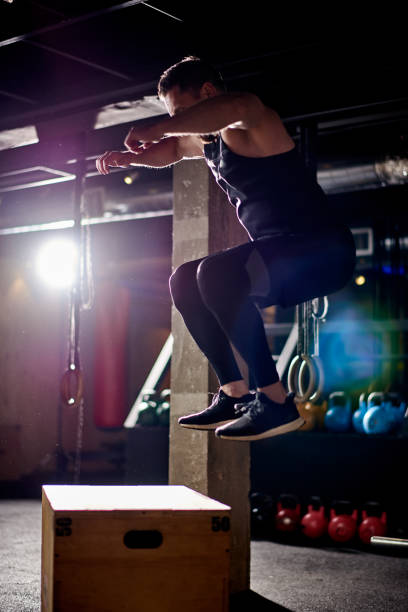 istock Male athlete jumping upwards 912075508