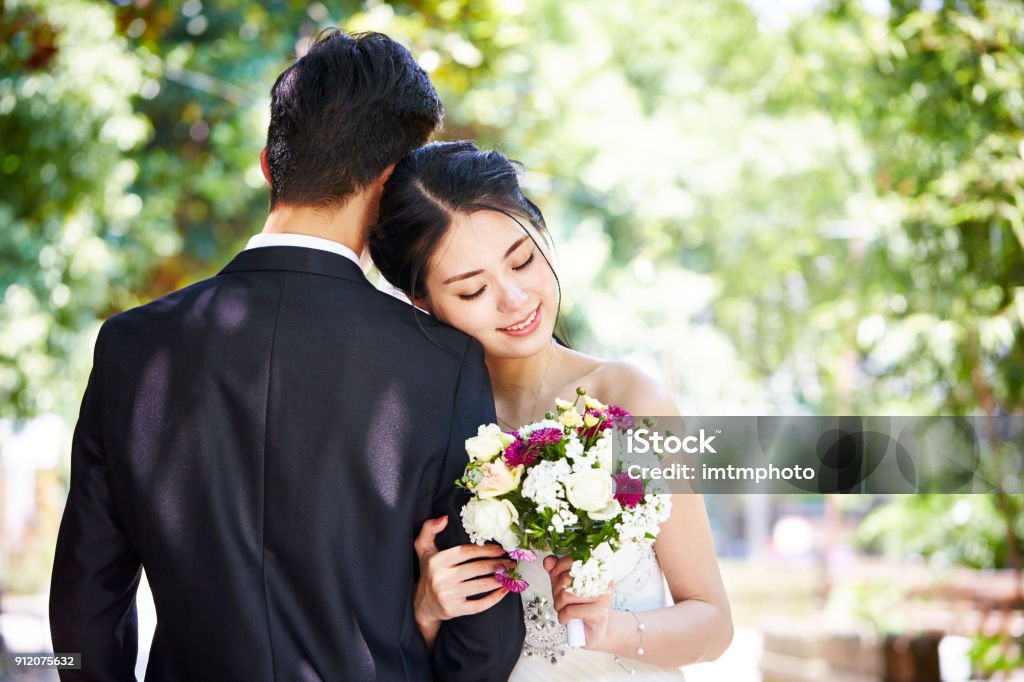 portrait of an asian wedding couple portrait of young asian bride and groom at wedding ceremony. Wedding Stock Photo