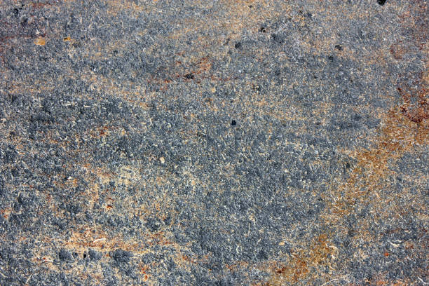 istock Old paint on an old wall. Large grunge textures and backgrounds. 912083396