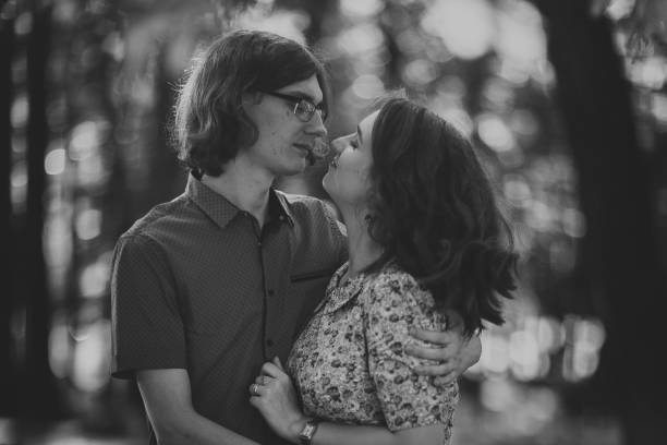 istock Beautiful young couple on the park background 912084866