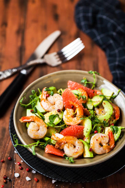 istock Delicious fresh salad with prawns, grapefruit, avocado, cucumber 912087494