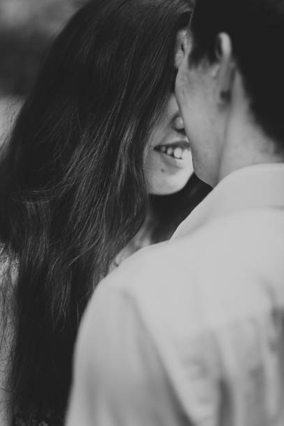istock Beautiful young couple in the park 912088070