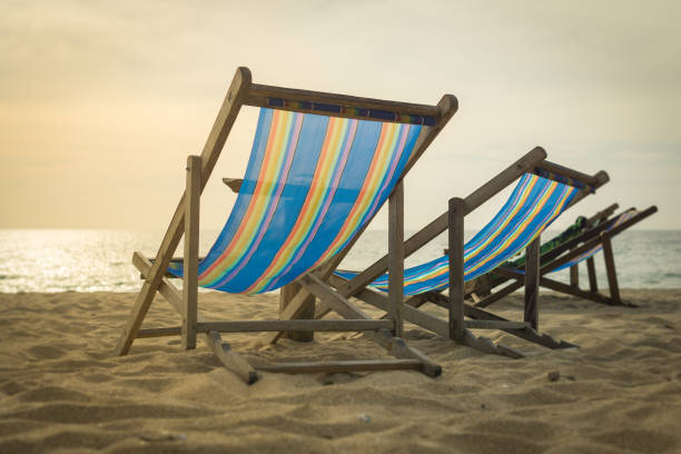 istock Empty sun lounge chair on the beach 912088144