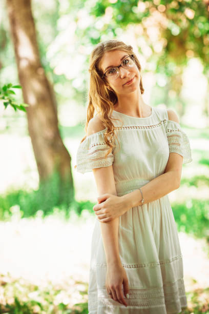 istock Beautiful young girl on natural background 912088498