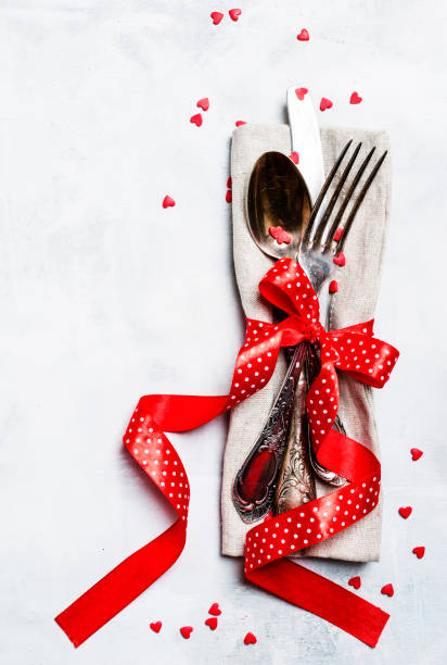 istock Festive table setting for Valentines Day, set of cutlery 912089794