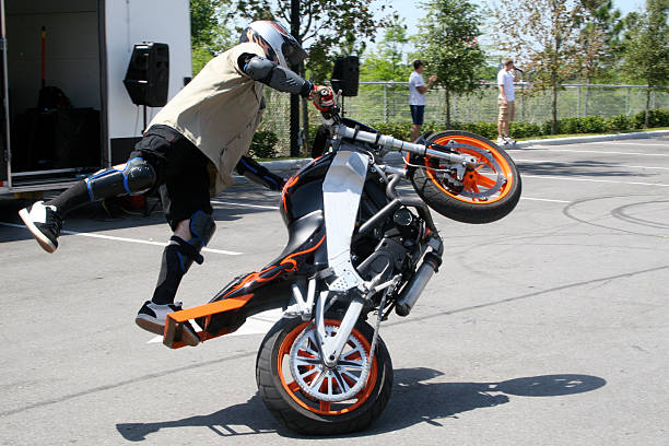 a man performing a trick on a bike