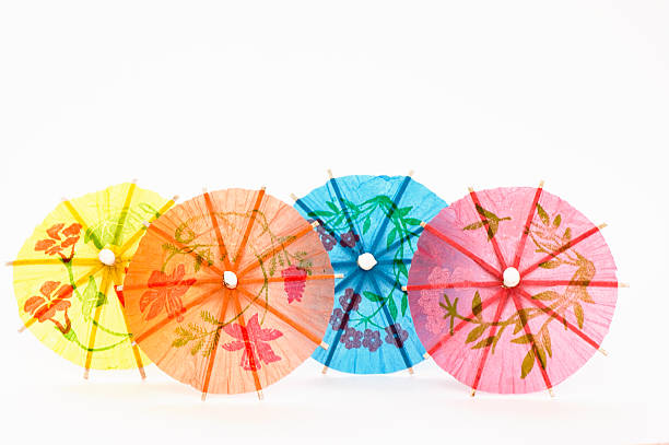 quattro colori di ombrelloni - drink umbrella umbrella parasol small group of objects foto e immagini stock