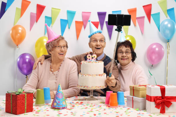 istock Happy seniors taking a selfie with a stick 912100946