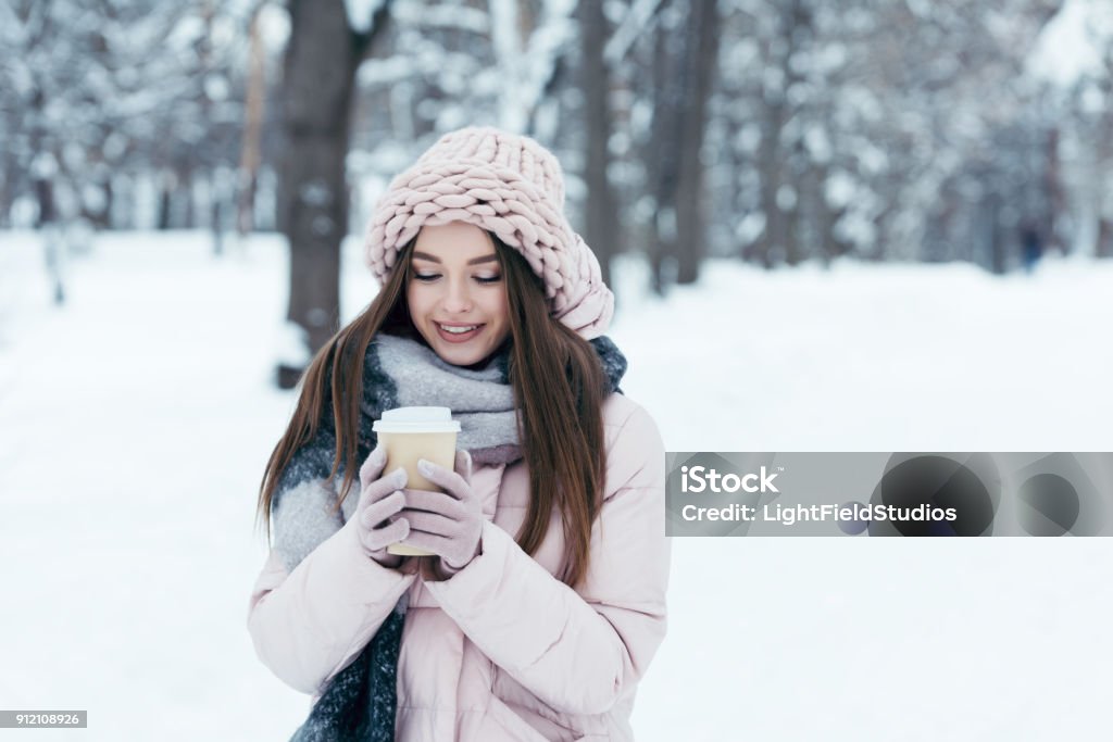 Portrait Of Attractive Woman In Winter Clothing With Coffee To Go On Winter  Day In Park Stock Photo - Download Image Now - iStock