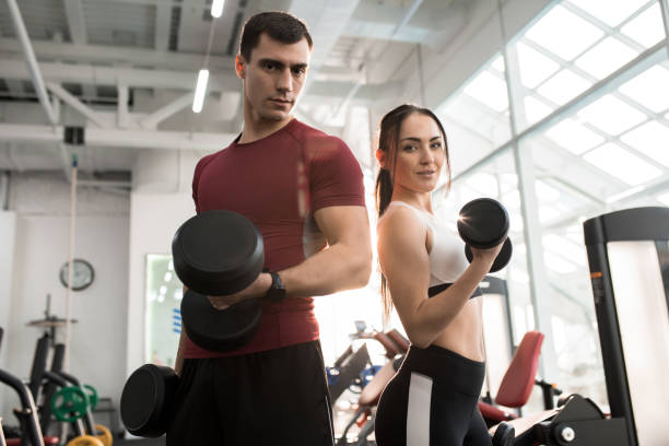 istock Fit Couple Posing in Gym 912113394