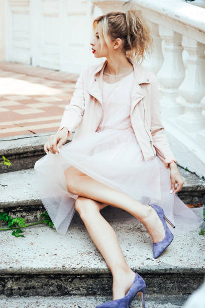 istock Girl is posing on the stone steps 912117336