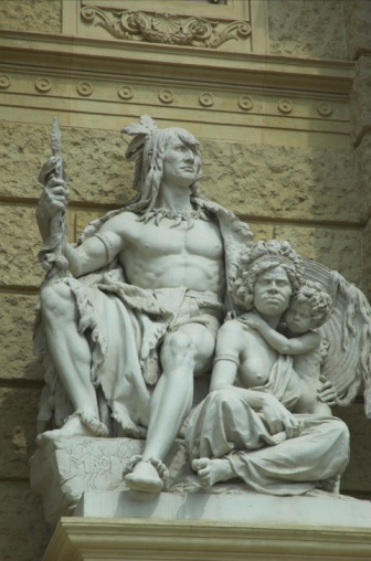 Statute of an American Indian chief and an Australian aborigine woman and child on the side of the old Hofburg  Palace in Vienna. Dates from the imperial period of the Hapsburgs when Vienna was a centre of power.