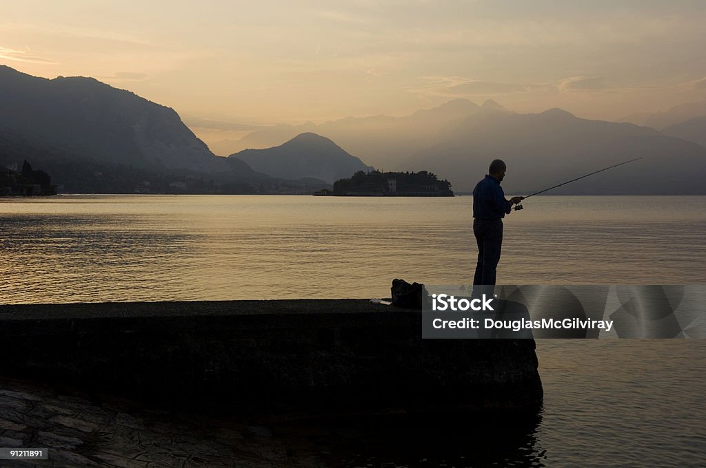 Fishing at Sunset  Beauty In Nature Stock Photo