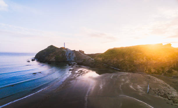 istock Top view of Castlepoint lighthouse with sunrise in background. 912121118