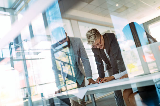 istock Collaboration and analysis by business people working in office 912125402