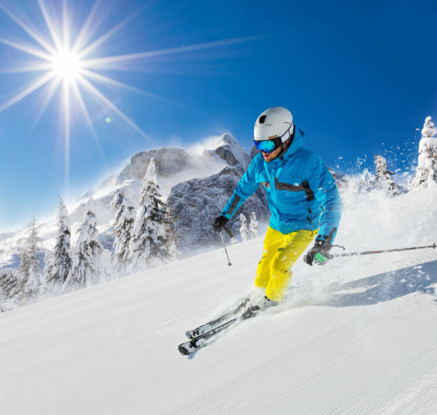istock Young man skiing downhill in Alps 912125544