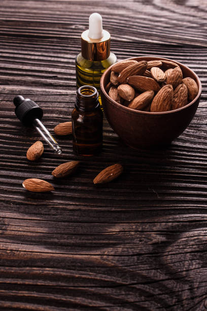 istock almond essential oil on a wooden background 912128778