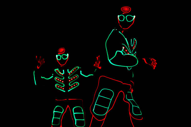 istock dancers in led suits on dark background, colored show 912129246
