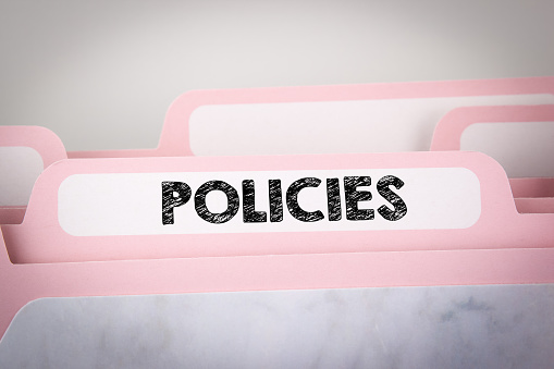 Policies Concept. Word on Folder Register. business background
