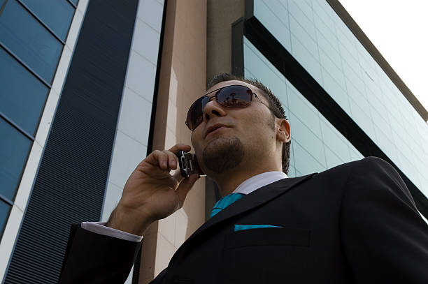 istock businesman and phone 91213160