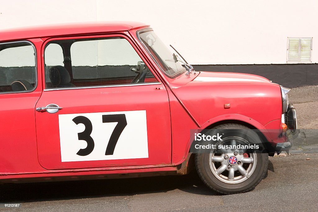 classic mini car with number thirty seven on the side car thirty seven showing signs of rust Alloy Wheel Stock Photo