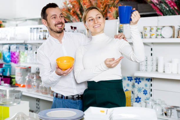 istock Couple choosing new crockery in dinnerware store 912133704
