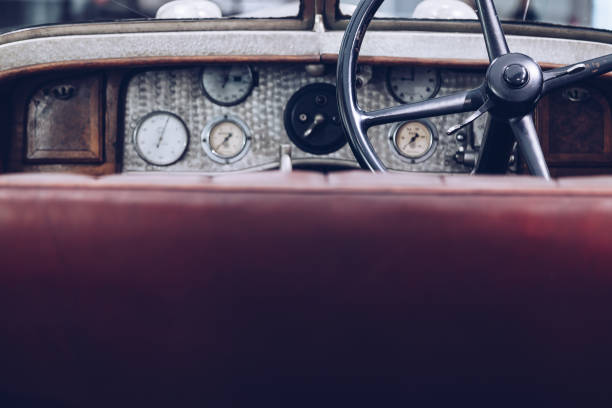 istock Interior vintage car with steering wheel and dashboard . with blurred foreground for copy-space. 912134590