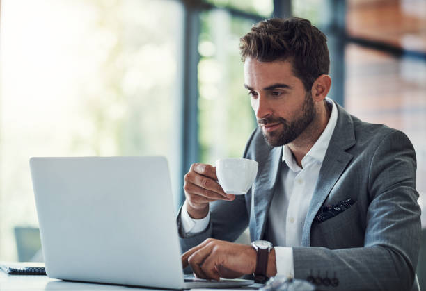 istock Coffee in one hand, productivity in the other 912138372