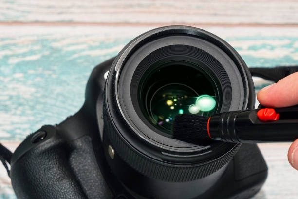 istock Digital SLR camera lens cleaning 912142218