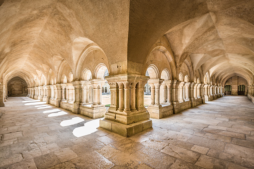 Beautiful view of the cloister courtyard of famous Cistercian Abbey of Fontenay, a UNESCO World Heritage Site since 1981, in the commune of Marmagne, Burgundy, France