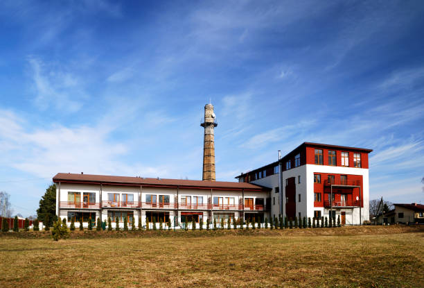 istock Modern detached house with pipe from old factory 912147030