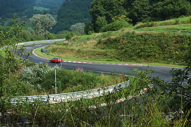 mountain road and a car  nürburgring stock pictures, royalty-free photos & images