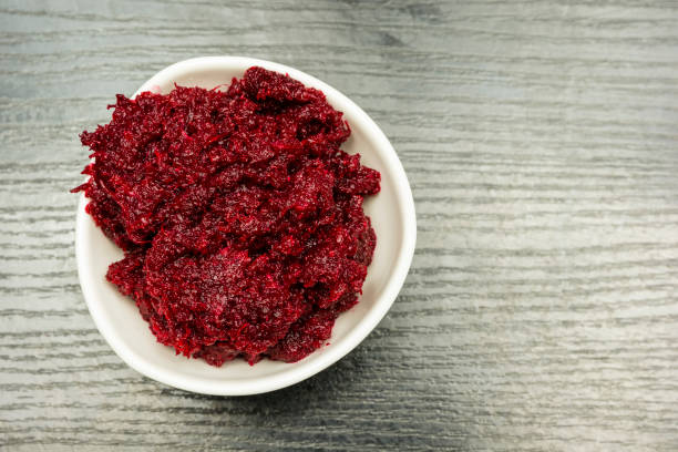 istock Grated beetroot with horseradish in a white bowl. View from above. 912151790