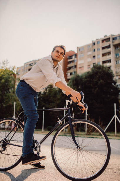 istock Bike man looking at something 912151990