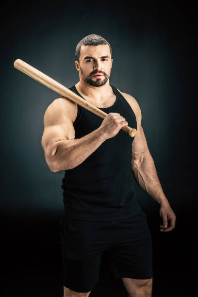 istock sportive man with baseball bat 912152098