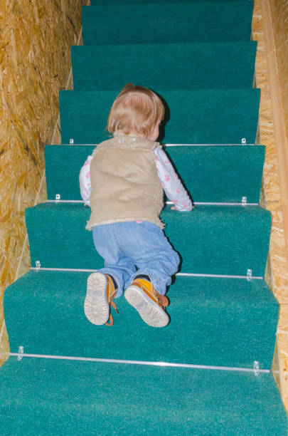 istock climbs the stairs safely child 912152314