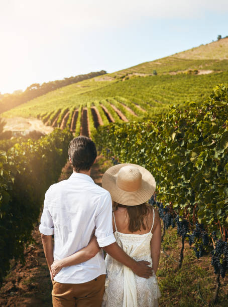 Couple walking in vineyard