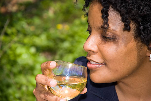 istock African American woman drinking wine 91215281